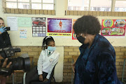 Grade 12 pupils at Phulong Secondary School in KwaThema with basic education minister Angie Motshekga. 