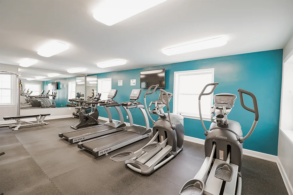 Fitness center with treadmills and weight machines