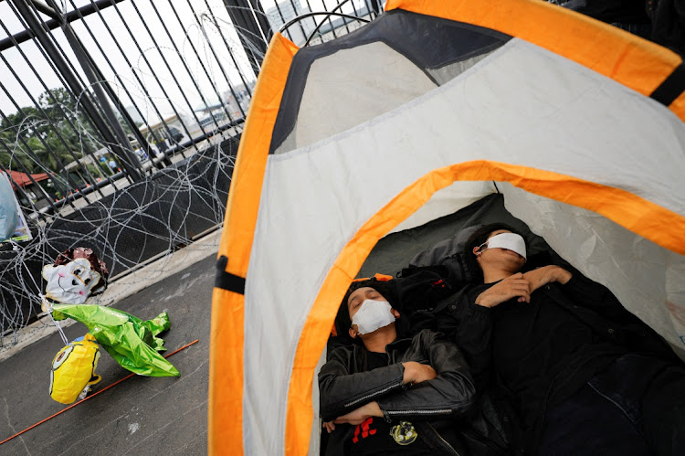 Activists protest after Indonesia's parliament approved a new criminal code, outside parliament in Jakarta, Indonesia. Picture: REUTERS/WILLY KURNIAWAN