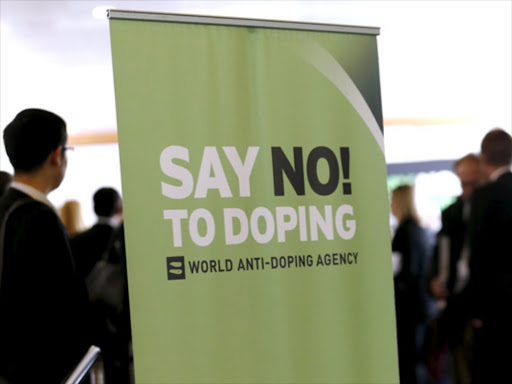 Participants talk before the start of the World Anti-Doping Agency (WADA) Symposium for Anti-Doping Organizations in Lausanne, in this March 24, 2015 file photo /REUTERS