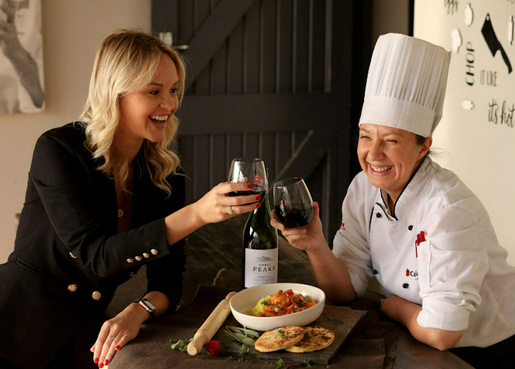 Chantal Schoonbie, of Three Peaks Wine, with chef Bernice Warner and her Portuguese chicken with pan-fried flat bread at the Capsicum campus