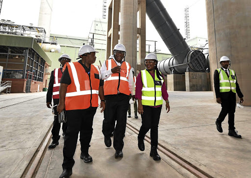 Eskom chairperson Jabu Mabuza, President Cyril Ramaphosa and project manager Zandi Shange on a tour of Medupi power station in Lephalale, Limpopo. Ramaphosa signed a certificate for the completion of the second last unit and the station will be fully functional from March. / Jairus Mmutle/GCIS