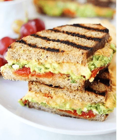 Roasted red pepper hummus avocado feta sandwich