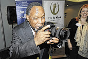 HERE'S LOOKING AT YOU: Former president Kgalema Motlanthe takes a picture of FW de Klerk during an event to commemorate the latter's February 2 1990 speech which signalled the end of apartheid