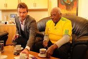 Archbishop Desmond Tutu meets with English footballer David Beckham at his offices in Milnerton, Cape Town on June 17 2010, on the eve of England's World cup game against Algeria. Beckham showed his support for the Desmond Tutu Peace Centre. 