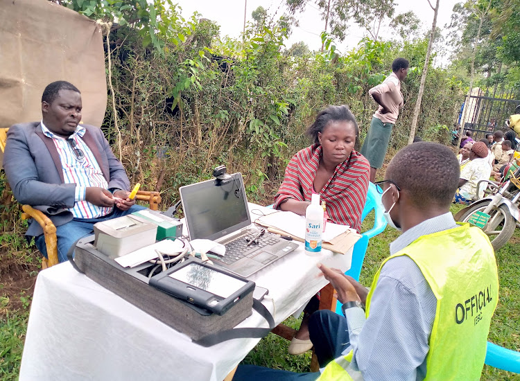 Isaac Otenyo pitches his camp at Es'saba center for hunting new voters in Emuhayua sub-county.