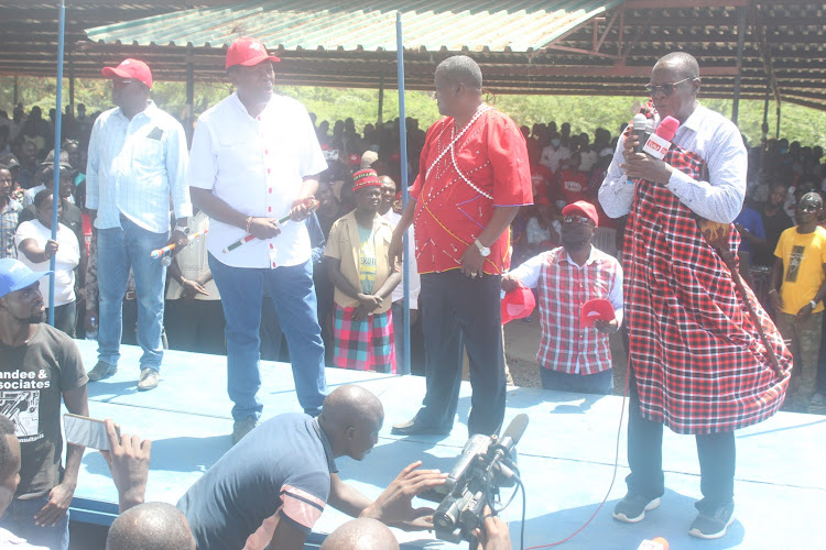 Turkana Senator Malachy Ekal (Right) with Former CS for Petroleum and Mining John Munyes (Centre) and CS for Defence Eugene Wamalwa addresses residents of Lodwar at Moi Gardens Ground.