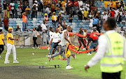 Fans vandalising the stadium during the  Nedbank Cup match between Kaizer Chiefs and Free State Stars at Moses Mabhida Stadium in Durban on Saturday.