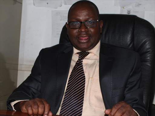 Nairobi County Chief lands Valuer Issac Nyoike in his office./FILE