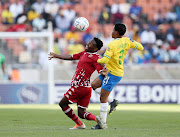 Victor Letsoalo of Sekhukhune United challenged by Sphelele Mkhulise of Mamelodi Sundowns during the DStv Premiership 2022/23 match between Sekhukhune United and Mamelodi Sundowns at the Peter Mokaba Stadium, Polokwane on  20 August 2022.