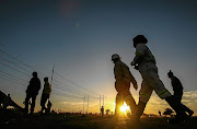 Miners at the Lonmin platinum mine head to work.