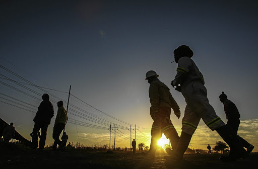 Miners at the Lonmin platinum mine head to work.