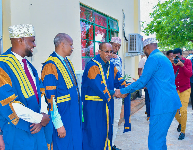 Wajir Governor Ahmed Abdullahi is received by the assembly leadership during his annual Status of the County Address at the Wajir county assembly.
