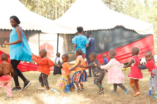 Irene Otieno of iHELP takes kids through simulation activities at the training exercise.