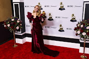 Adele poses with her Grammy for Best Pop Solo Performance for 