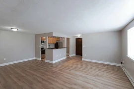 Living room with wood floors and white trim