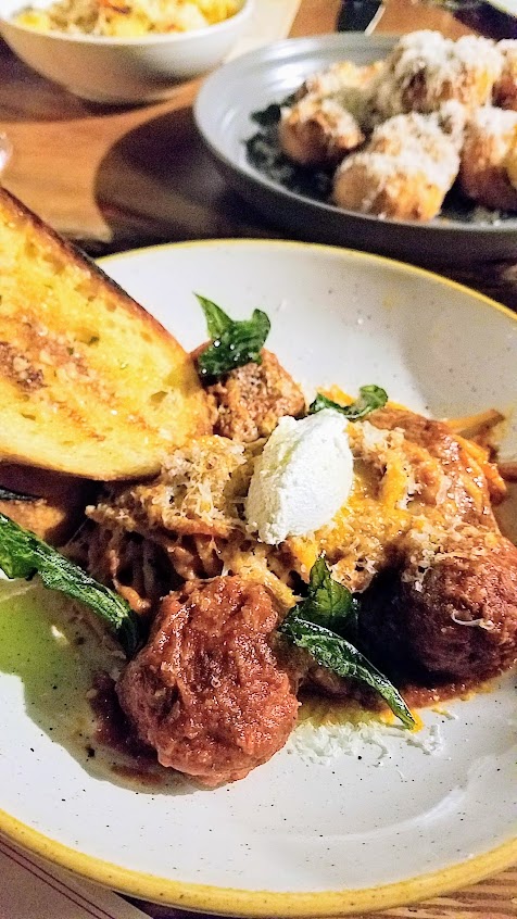 A Look at Il Solito PDX, Spaghetti and Meatballs with marinara, ricotta, grana padano, garlic bread