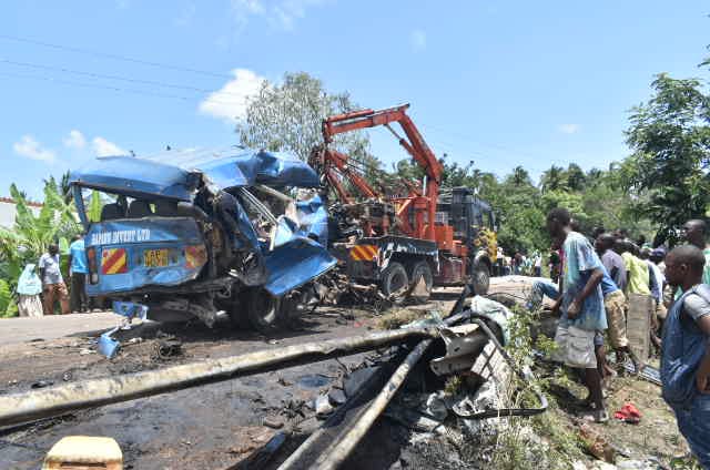 Residents view wreckage of one of the buses at Makobeni along Kaloleni-Mazeras road on Monday/ANDREW KASUKU