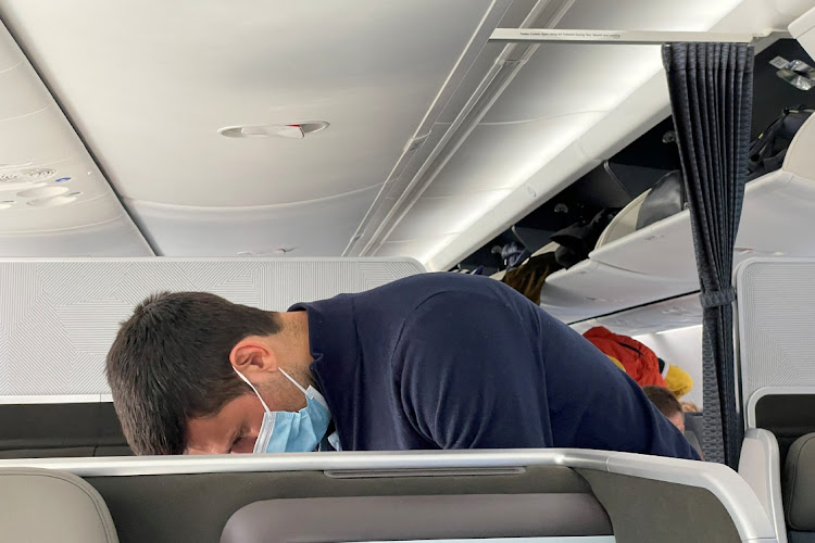 Novak Djokovic is seen after boarding a plane, after the Australian Federal Court upheld a government decision to cancel his visa to play in the Australian Open, in Dubai, United Arab Emirates, January 17, 2022.