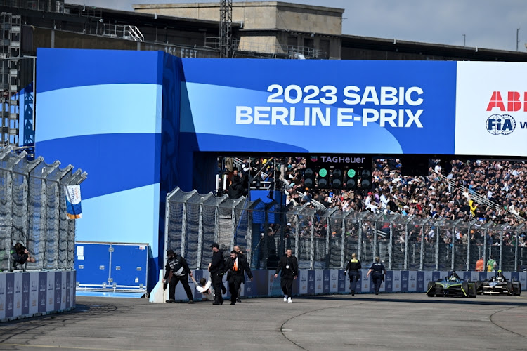 ABB FIA Formula E World Championship protesters on the grid being removed by security