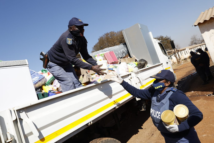 Police raids took place in Vosloorus where stolen goods were recovered following the looting that took place two weeks ago in Gauteng. Picture: THULANI MBELE