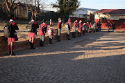 Selope Thema Primary School pupils in  Orlando East, Soweto,  line up to enter  school grounds.