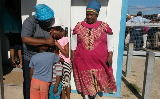 Ayanda Mdlulwa‚ 31‚ is still shaken after her three children were taken on Wednesday night while in their care of their grandmother Mandisa Mdlulwa (right). Picture: Siyamtanda Capa