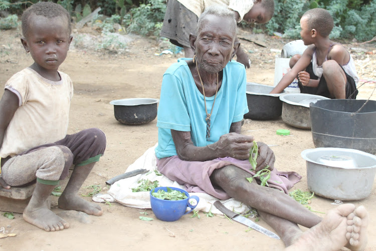 Emaciated 90-year old Turkana granny Mary Naukot prepares wild vegetables at Kampi Turnana in Marigat, Baringo South subcounty on March 10.