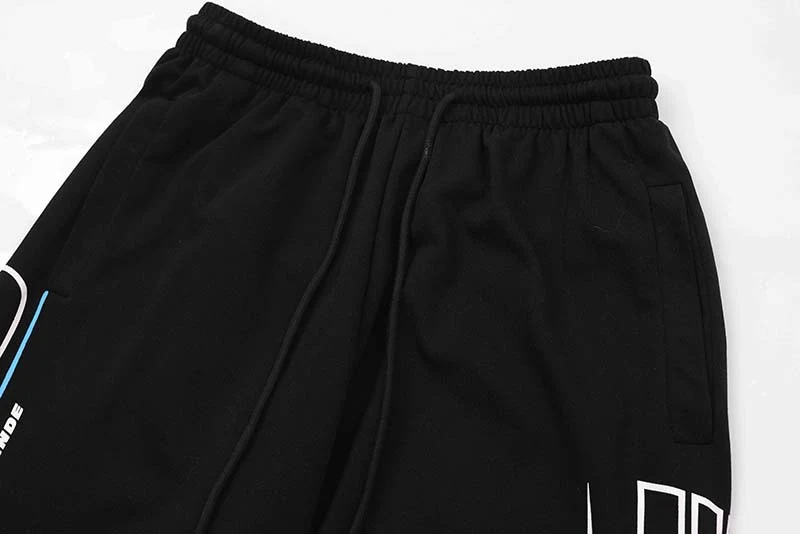 Pantalones deportivos retro para ciclistas, estilo racing con letras. Cómodos para hombres y mujeres. Disfruta del diseño único y la comodidad.