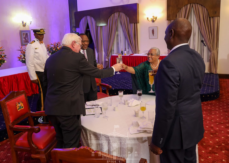 President Uhuru Kenyatta toasting when he and First Lady Margaret Kenyatta hosted a state banquet in honour of the visiting German President Frank-Walter Steinmeier. /PSCU