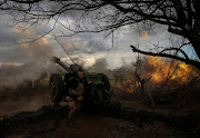 Ukrainian service members from a 3rd separate assault brigade of the Armed Forces of Ukraine, fire a howitzer D30 at a front line, amid Russia's attack on Ukraine, near the city of Bakhmut, Ukraine April 23, 2023. 