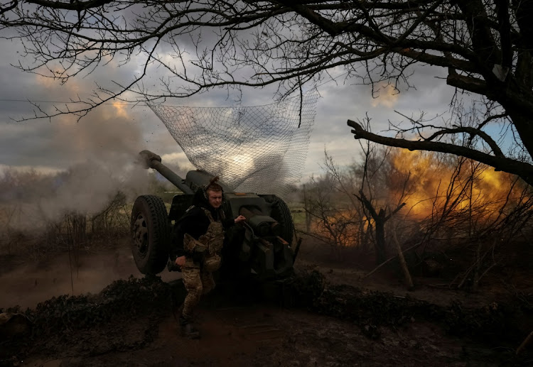 Ukrainian service members from a 3rd separate assault brigade of the Armed Forces of Ukraine, fire a howitzer D30 at a front line, amid Russia's attack on Ukraine, near the city of Bakhmut, Ukraine April 23, 2023.