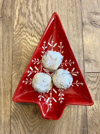 Mini Chip Snowball Cookies in a red holiday tree plate.