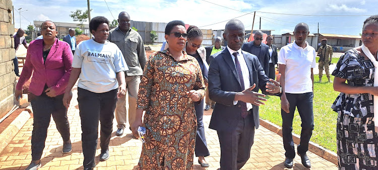 Yono Bagumo the director generol NARO quides members of porioment led by committee lanet 0kor at the inspection ofthe voccine productian center located at Namulongemoge: Moses kidandi-Capitol FMUganda will produce 10 million Animal vaccines