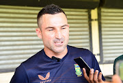 Dean Elgar address media before the team's departure for a three-match Test series against Australia.