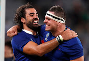 France's Yoann Huget and Guilhem Guirado celebrate after the match.