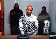 Rapist and murderer Thabo Bester wearing a Monogram Bandana motif crewneck sweatshirt by Louis Vuitton valued at more than R20,000.