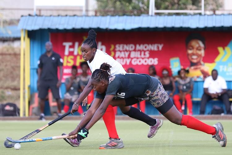 Blazer's Caroline Guchu contests for the ball with Gilly Okumu of Strathmore during their KHU Premier League clash at City Park Stadium