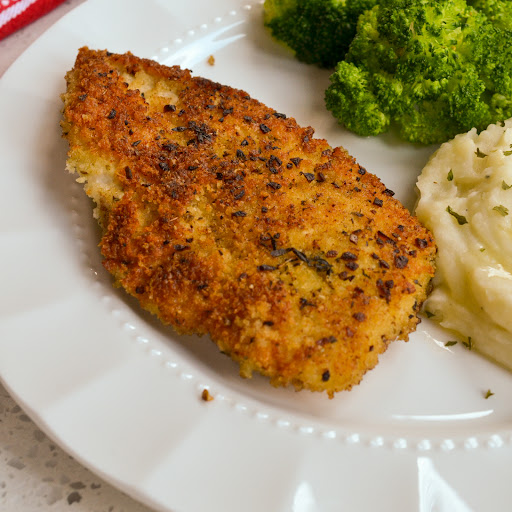 A quick and easy Parmesan Crusted Chicken recipe with a crispy and flavorful panko Parmesan crust.  Friends and family just love this tasty chicken. 