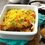 Potluck Taco Casserole Recipe was pinched from <a href="http://www.tasteofhome.com/recipes/potluck-taco-casserole" target="_blank">www.tasteofhome.com.</a>