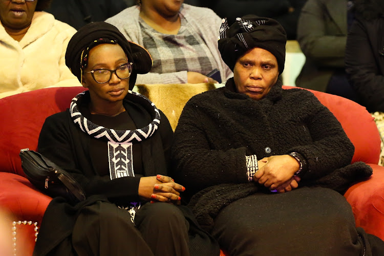 Family member Cebisa Rapatsa, left, with businessman Ulundi ‘Dinki’ Mpulu’s mother Nomfundo at the memorial service