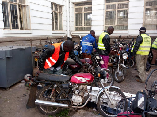 Nairobi boda boda riders collect motorcyles that had been impounded from the county's holding yard/FILE