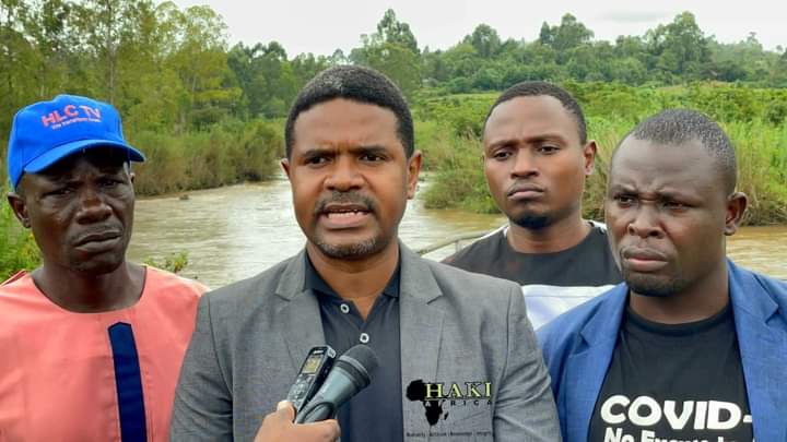 Nicholas Okite Okero (far left) with Hussein Khalid of Haki Africa and other rights activists on the banks of River Yala.