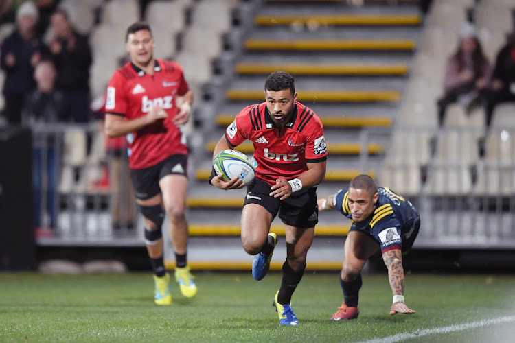 Richie Mo'unga of the Crusaders scores a try during the Super Rugby quarterfinal against the Highlanders at Orangetheory Stadium on June 21 2019 in Christchurch, New Zealand.