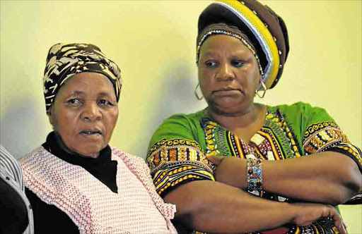 Saba Mbixane's mother, Mazulu and his wife, MaMaduna were among those attending the prayer service. Picture: LOYISO MPALANTSHANE