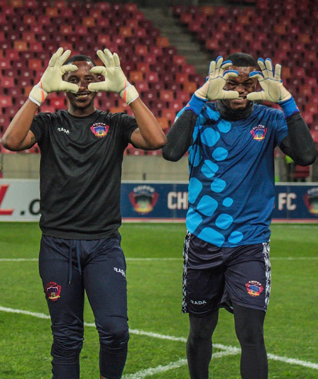 Chippa United goalkeeper coach Sean Louw shares a lighthearted moment with Nigerian keeper Stanley Nwabili during a training session.