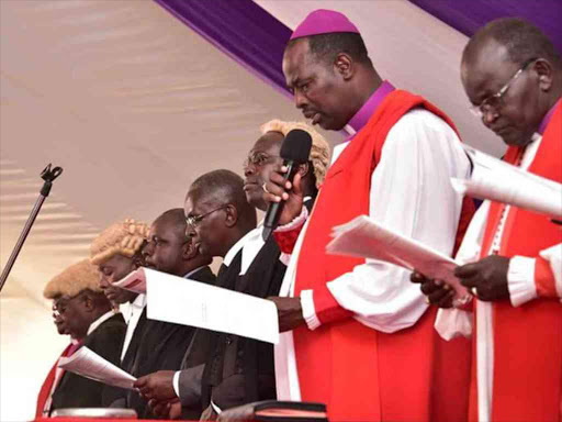 The Anglican Church Arch bishop Jackson Ole Sapit (second Right) leading the consecration ceremony of Bishop Timothy Gichere at Ihura Stadium on Sunday.