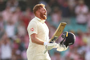 Jonathan Bairstow of England celebrates scoring a century on day three of the fourth Test in the Ashes series against Australia at Sydney Cricket Ground on January 7 2022.