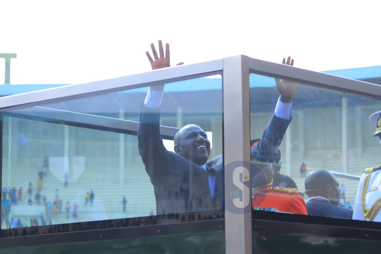 President William Ruto waving as he takes his first lap of honour around Kasarani after being sworn in on September 13, 2022.