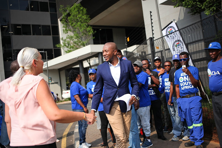 Leader of the Democratic Alliance Mmusi Maimane greets party supporters outside the Hill on Empire building in Parktown, Johannesburg, where the Commission of Inquiry into State Capture is being held.